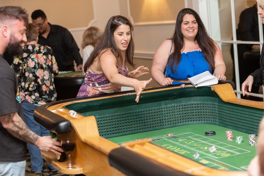 Guests playing games at a casino theme party