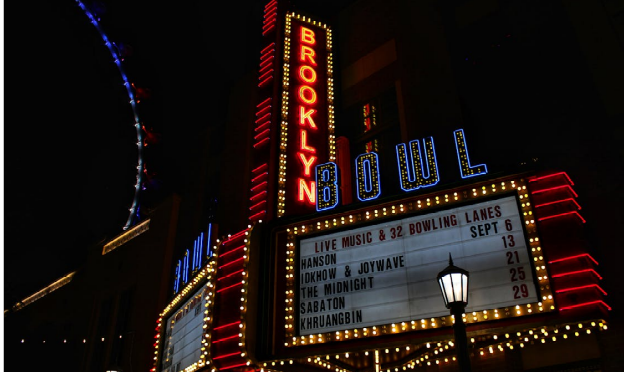 a large neon sign that reads brooklyn bowl
