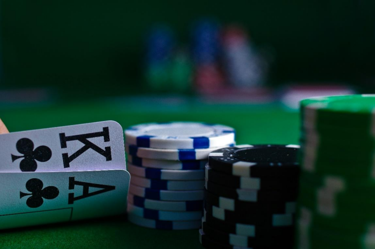 Chips and cards on a green casino table representing a fundraising casino game setup.